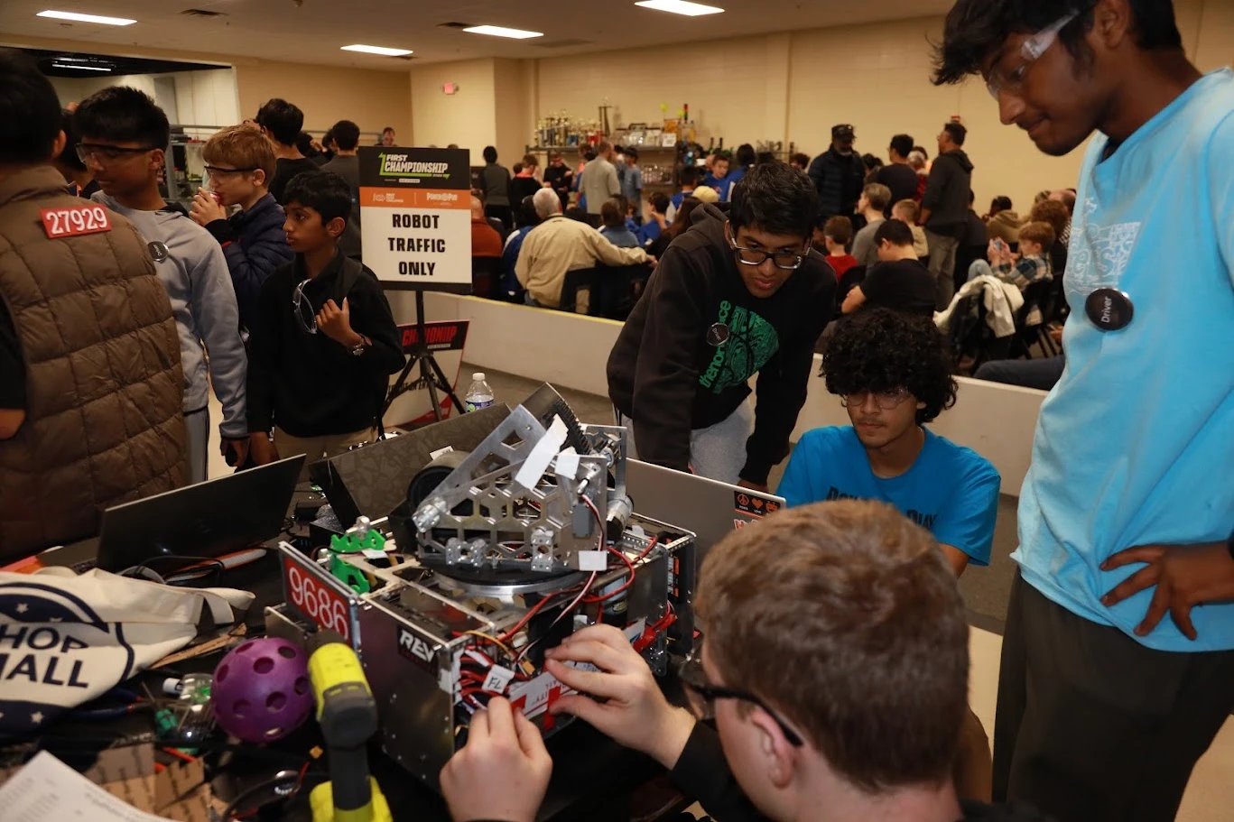 Raiders of the A.R.C. members preparing robot 9686 at the FIRST Championship