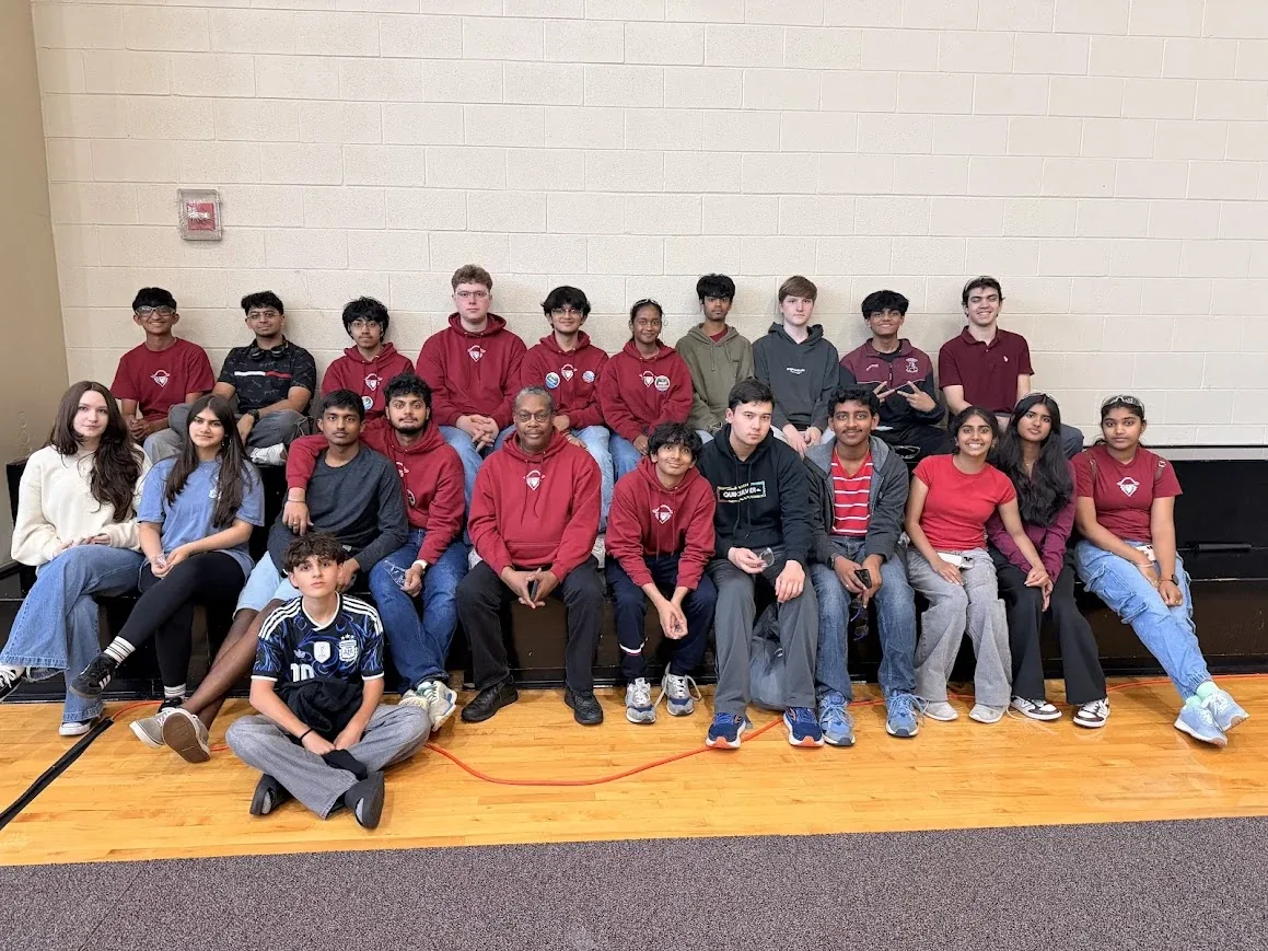 The full A.R.C. robotics club posing together in the gym