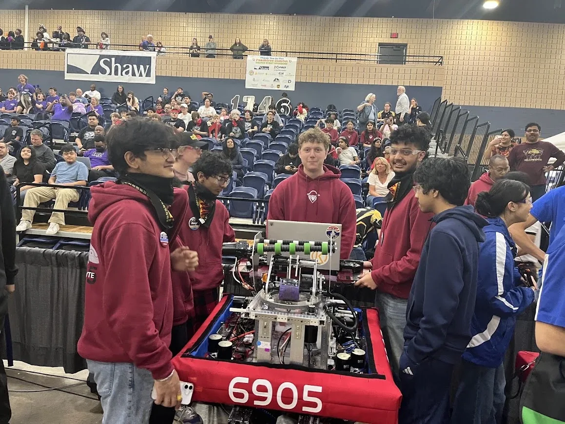 Tear-A-Byte team members at the robot between matches